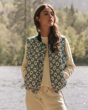 The Reversible Ultra Light Down Vest. -- Falling Daisy and Cream